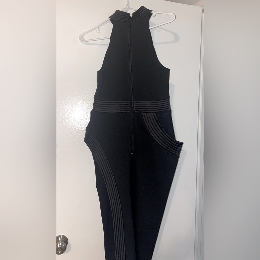 Black styled dress. Medium. The dress has sheer material on each side